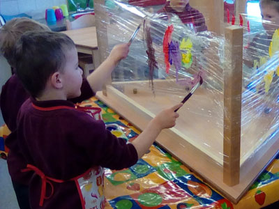 Children painting in playgroup